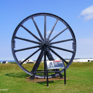 large iron wheel used in mining on display