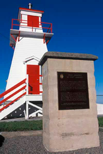 A tapered red and white tower lighthouse