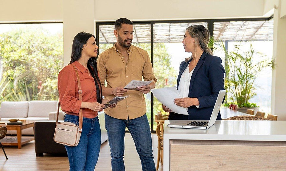 Homebuyers discussing a real estate offer with a Bend Realtor in Central Oregon.