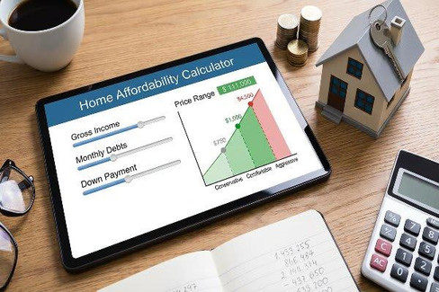 Homebuyers reviewing mortgage costs and affordability while shopping for a home in Central Oregon.