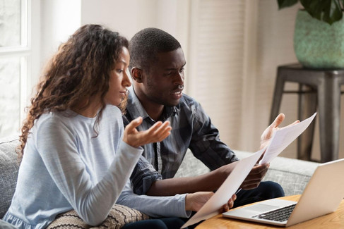 Homebuyers reviewing mortgage costs and affordability while shopping for a home in Central Oregon.