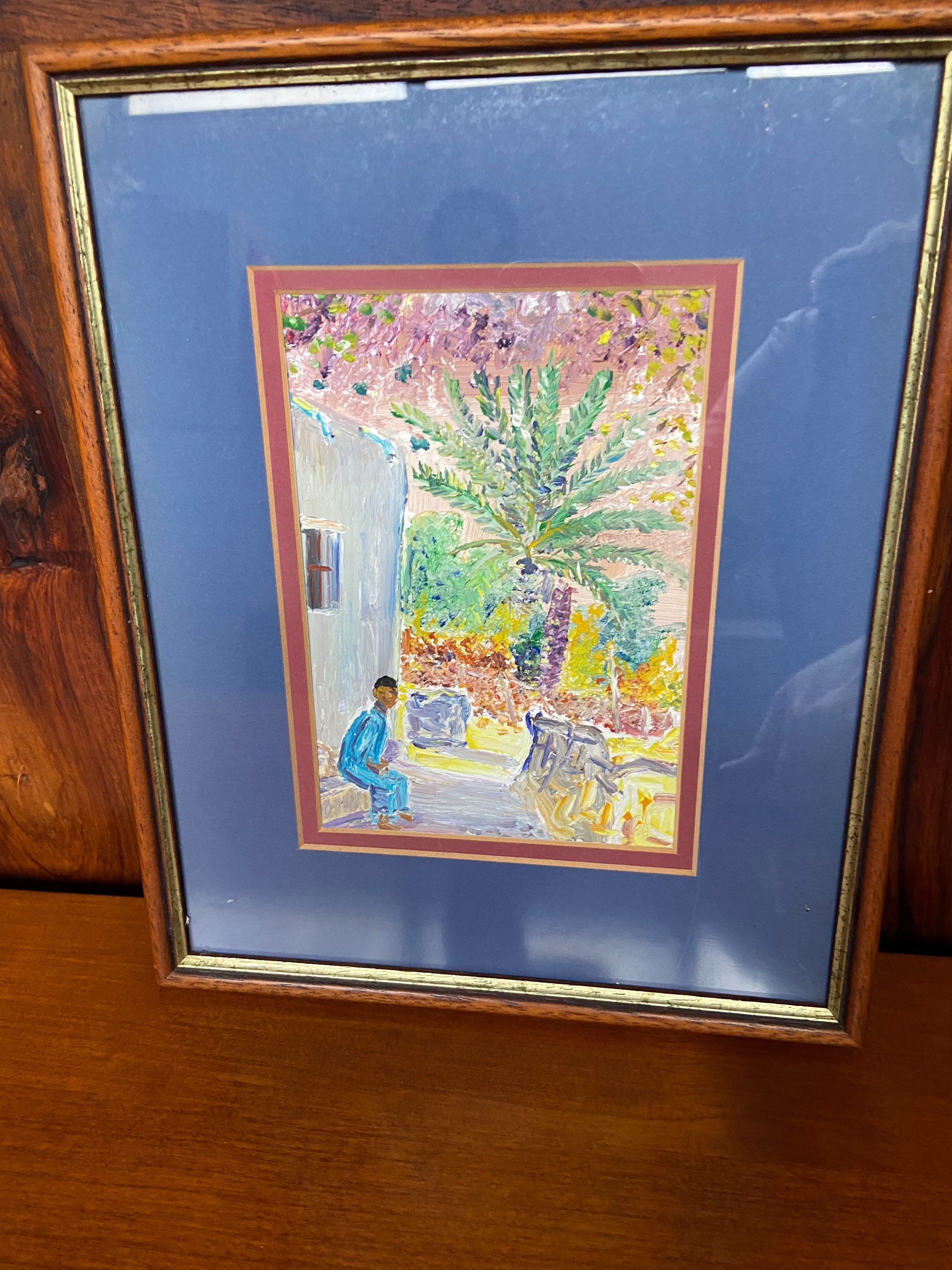 Framed man sitting painting 23.5x28.5 