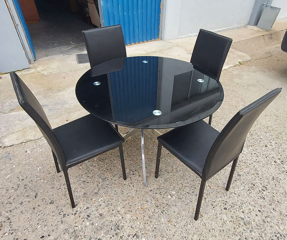 Thumbnail: Black glass and chrome round table with 4 black faux leather chairs (100 x 72) €