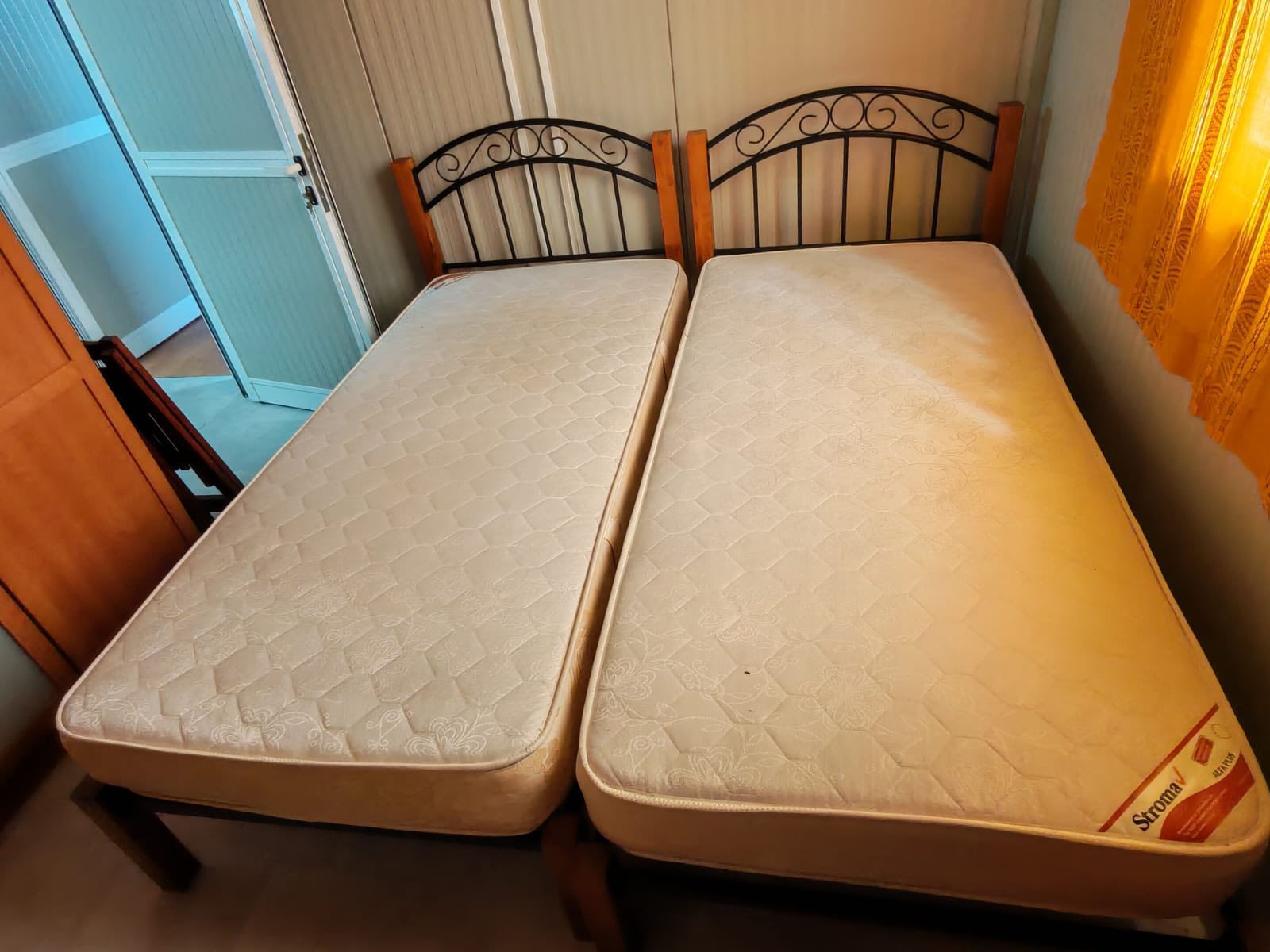 Pair of wood and metal single beds with mattresses (90 x 195) €180 the pair
