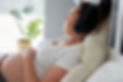 Pregnant woman relaxing while listening to music.jpg