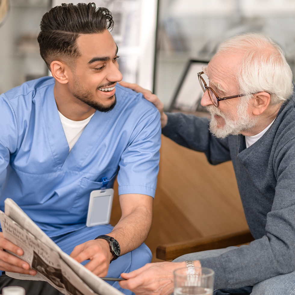 caregiver reading to senior man