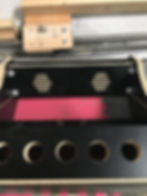 Insert the speaker panel by sliding it down and over the pegs and then securing the cams.