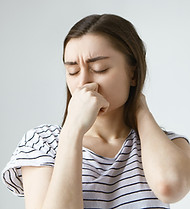 disgusted-young-dark-haired-woman-closin