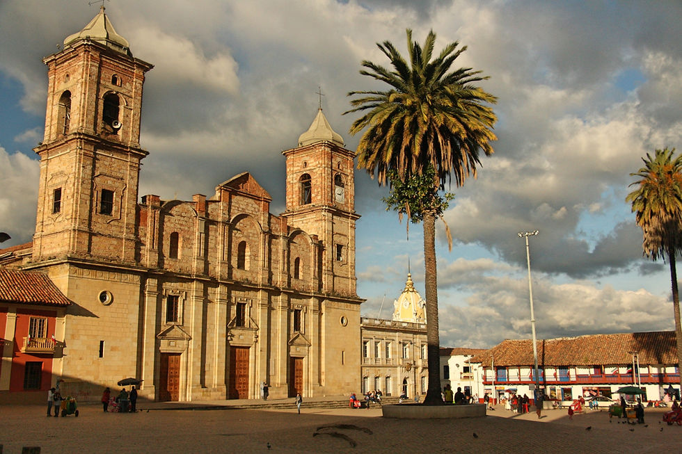 Colonial church and town square with palm trees in Zipaquira, Colombia.