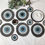 Thumbnail: Upcycled ash grey evil eye table mats (set of 2)