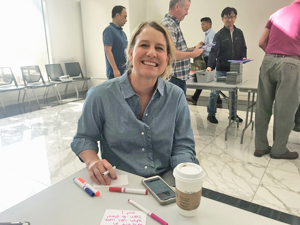 AT&T female volunteer writing a note of encouragement