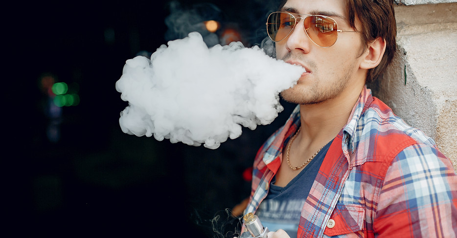 stylish-elegant-man-city-with-vape.jpg