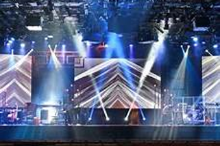 Blurred image of a crowd and lights at a corporate party