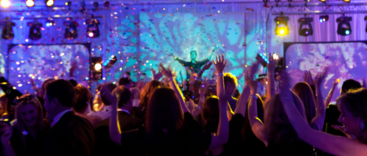 Crowd dancing to a DJ at a school event