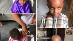 Children receiving haircuts and hearing the gospel at a KK Barbershop ministry location in Ethiopia, honoring Karl Keller’s legacy through community outreach.
