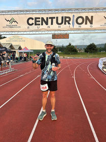 Bill poses at the finish line