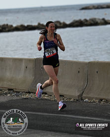 Alyssa running along the beach
