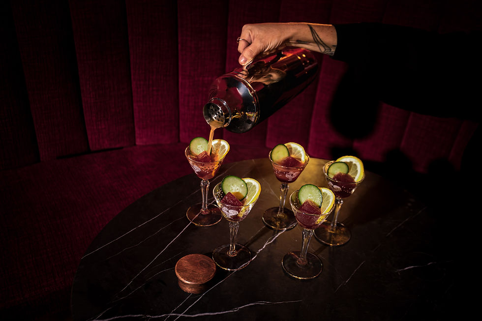 five cocktail glasses on a table