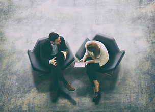 Loan officer hearing feedback from a borrower.