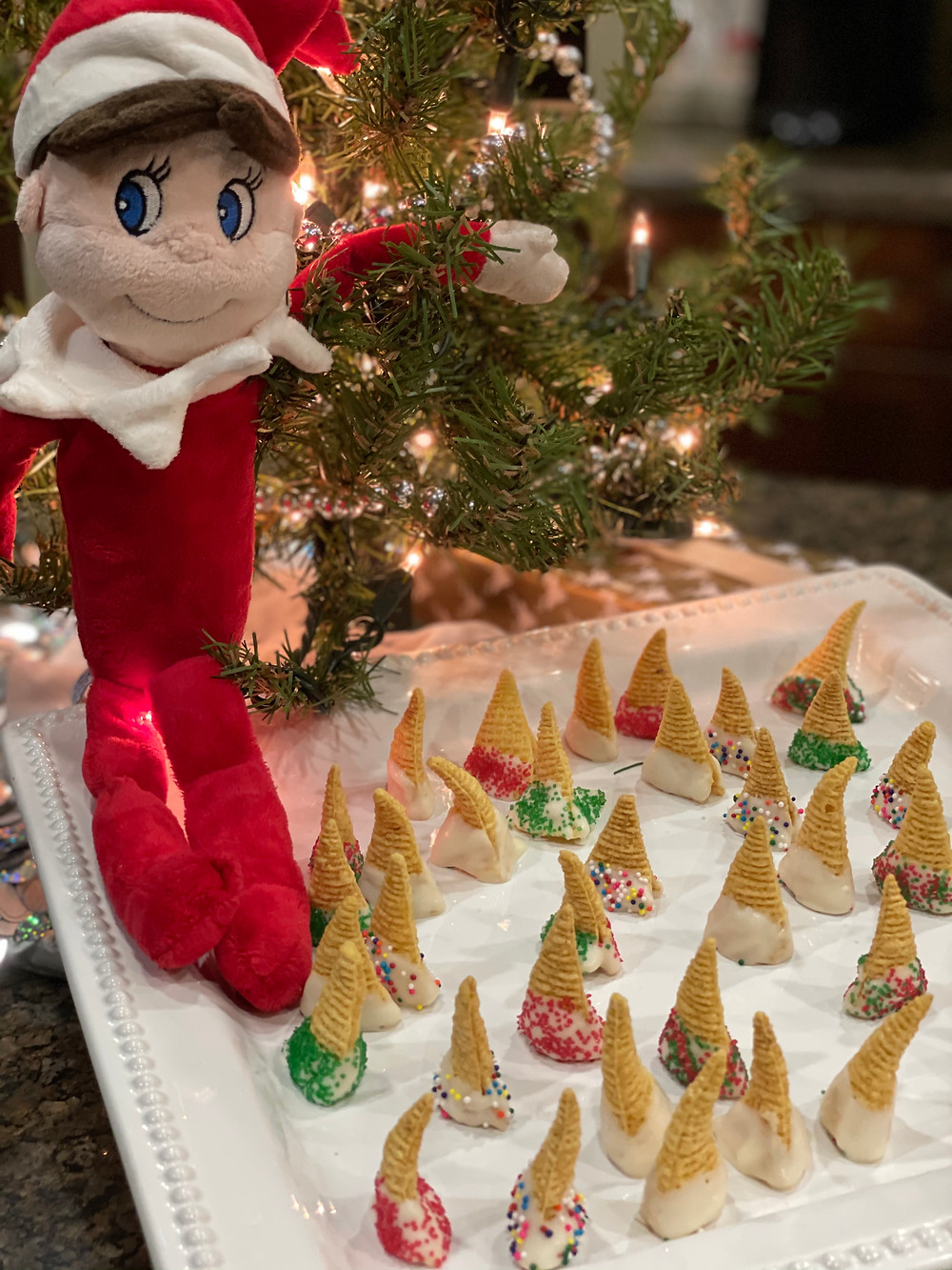 Plush elf and edible decorated elf hats