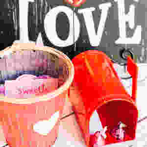 Love sign with red mailbox and valentine container