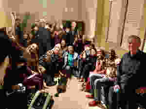 crowd of people at a party in a garage