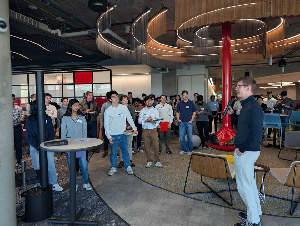 Student speaking to other students