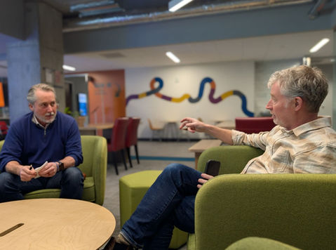 Two adult men talking