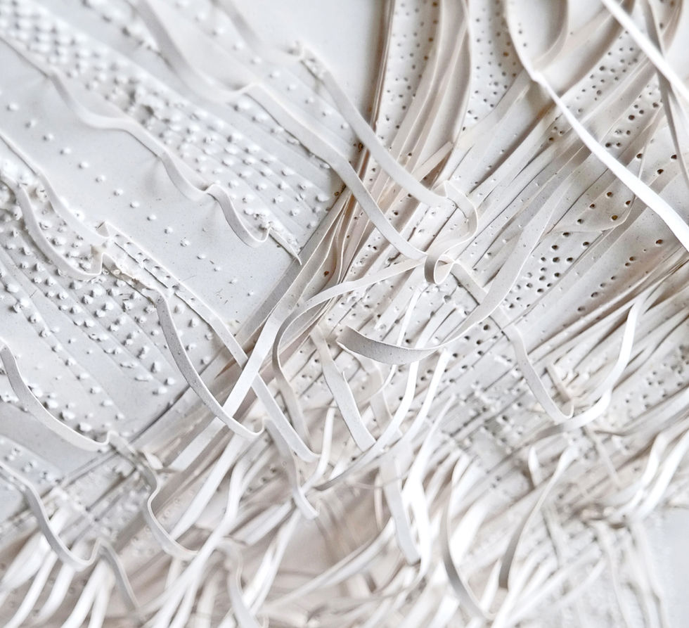 Seaweed-based paper sculpture exploring organic wave forms created by paper artist Anna Normand