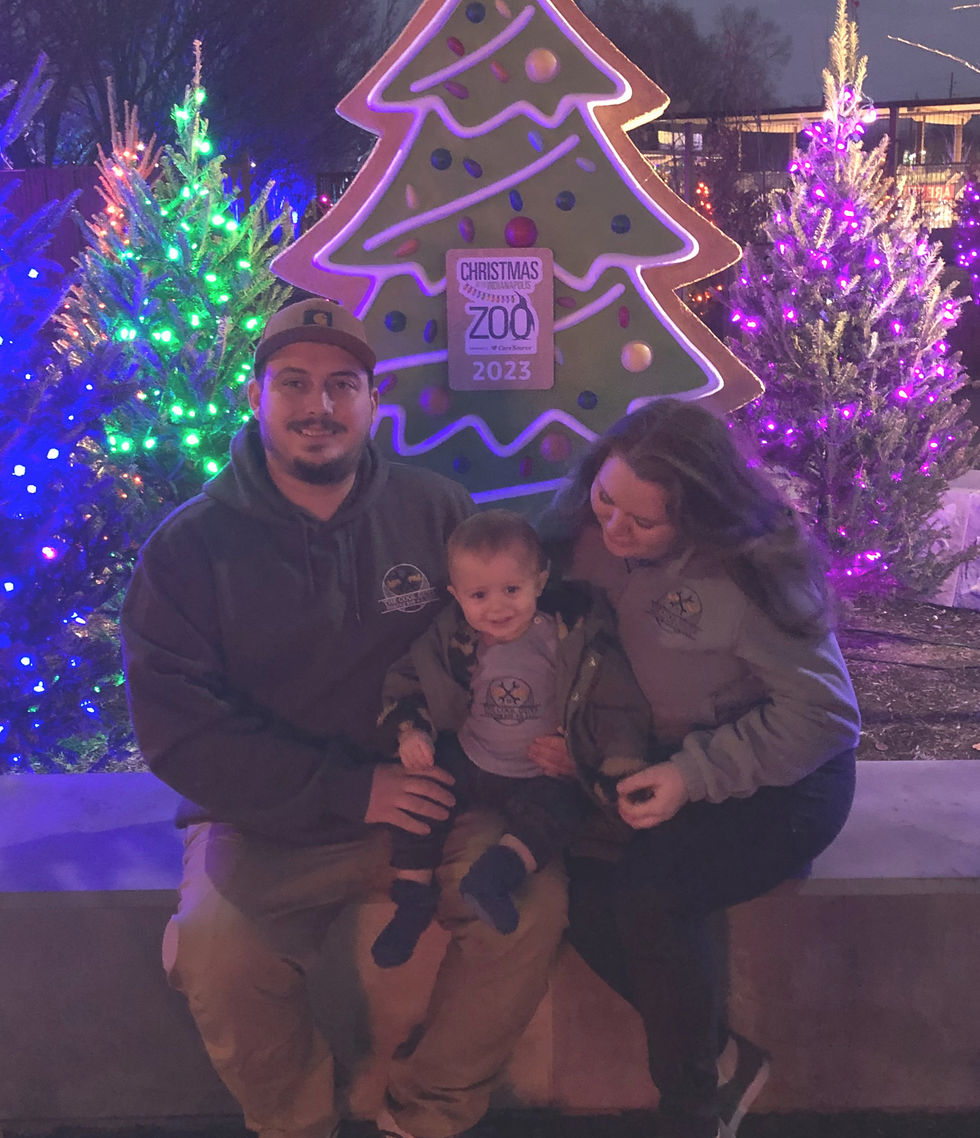 Justin, the owner (left) Allie, the office manager (right) and their son
