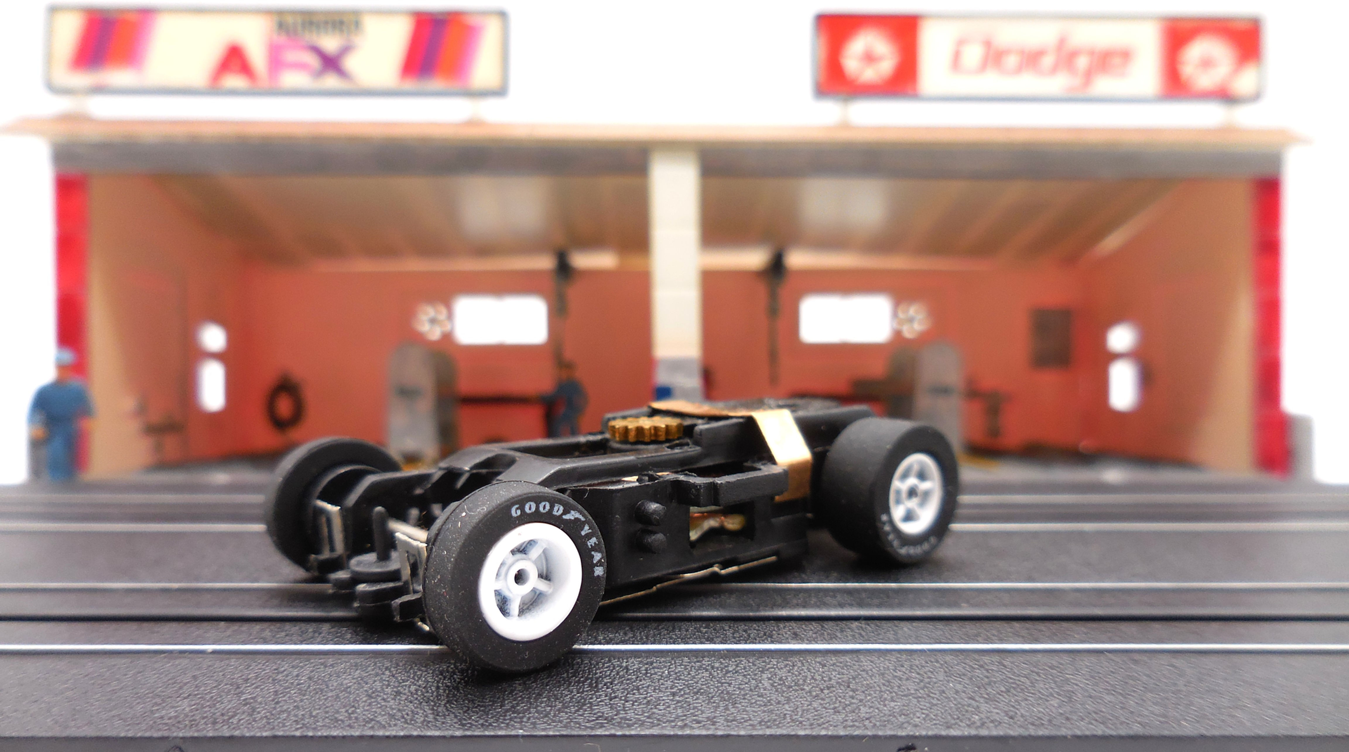 Auto World 1 New Xtraction Ultra G Chassis with White Rims Goodyear Tires