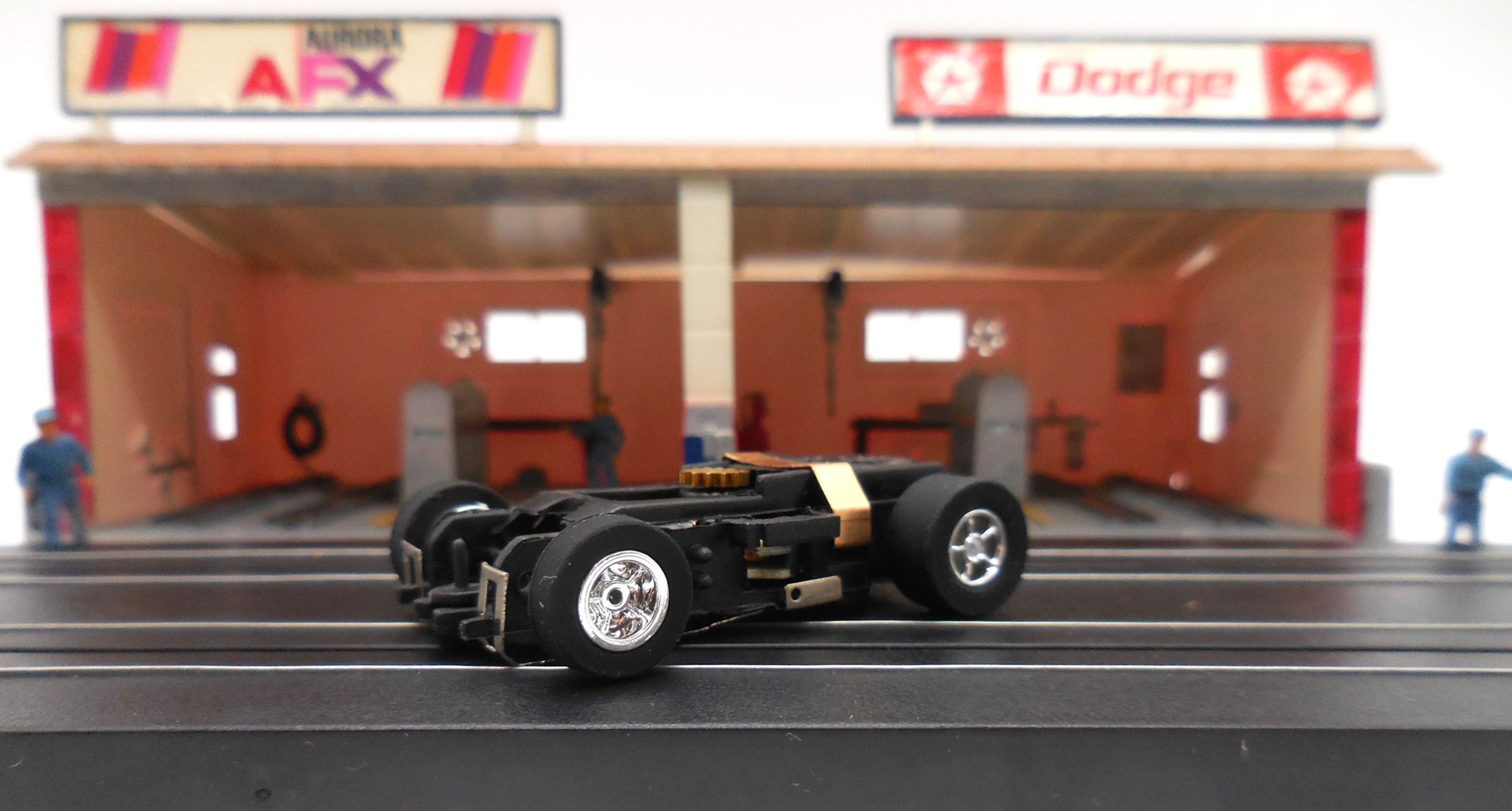 Auto World 1 New Xtraction Ultra G Chassis with Chrome Rims Black Tires