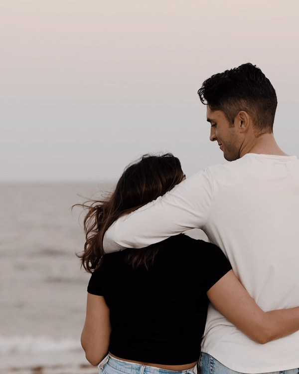 A couple viewing the ocean in their elopement video