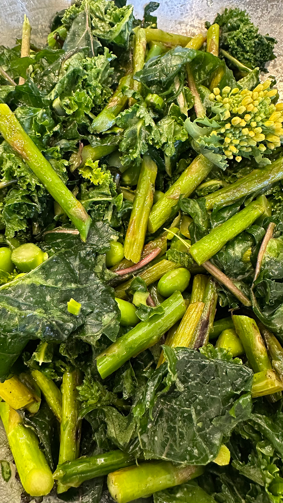 Flowering spring kale tops add colour to this creative spring salad combination of kale, edamame, asparagus and mustardy maple syrup dressing