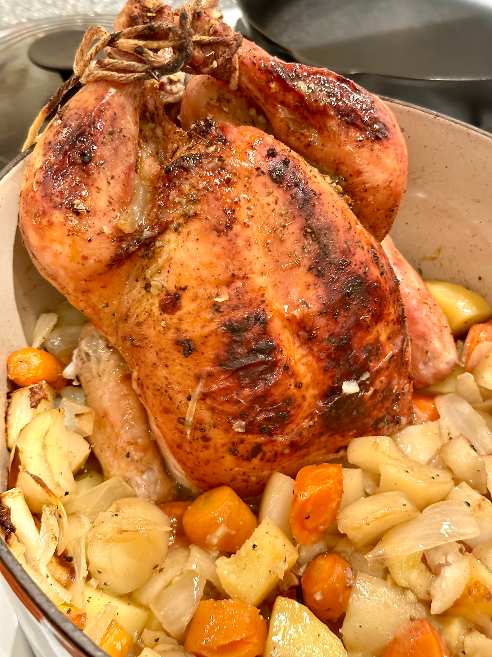 A whole roasted chicken with roasted root vegetables is a perfect meal to recycle leftovers into new dishes and reduce food waste.