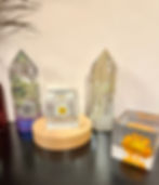 Handmade resin cube showcasing a delicate daisy-style flower, ideal as a decorative paperweight or decor accent