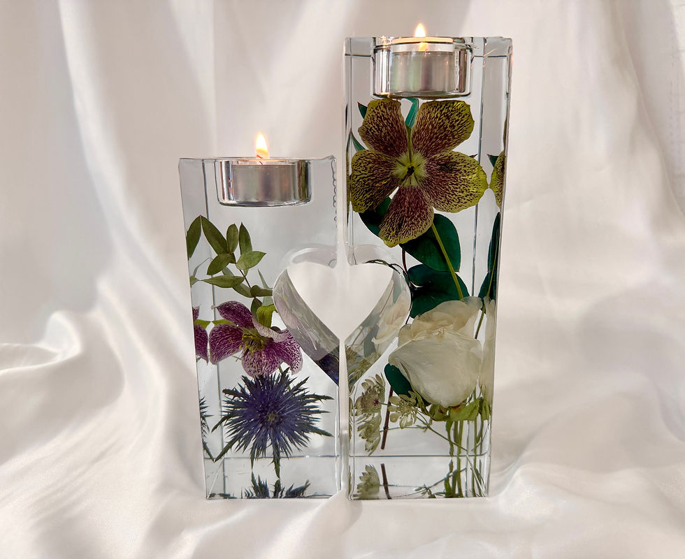 Two column tea light holders with heart cut out, filled with bridal flowers