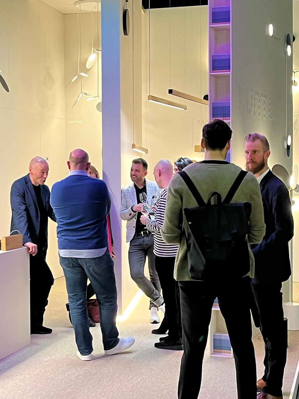 People learning about Tunto Lighting’s innovations at Light + Building Fair 2024 in Frankfurt, Germany.