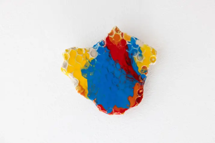 Abstract mixed-media wall object created with plaster, pigments and epoxy. Inspired by Wonder Woman as an icon of feminist pop culture, the work represents female empowerment, equality and the values of courage, resilience, independence, empathy, truth and justice.