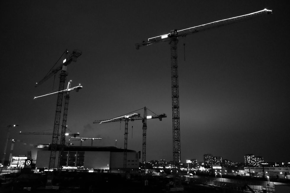 cranes-construction-site-against-sky-city-night.jpg