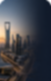 The skyline of Riyadh features the Kingdom Tower at sunset.