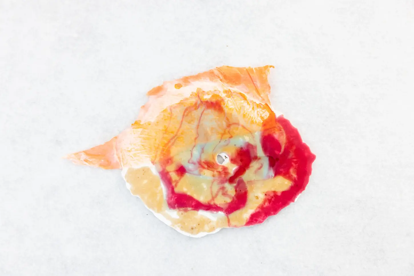 Abstract mixed-media wall object created with plaster, pigments and epoxy. Inspired by the beauty of nature, the work transforms organic forms into a distinctive visual language that invites curiosity and personal interpretation.