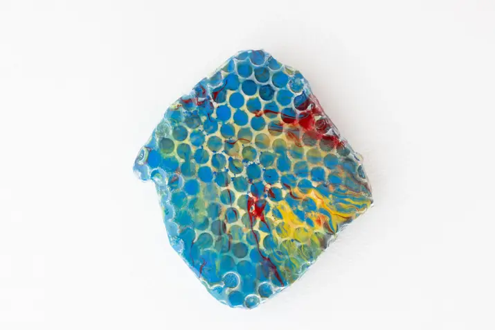 Abstract mixed-media wall object created with plaster, pigments and epoxy. Inspired by the beauty of nature, the work transforms organic forms into a distinctive visual language that invites curiosity and personal interpretation.