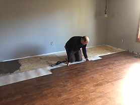 Worker Installing New Flooring