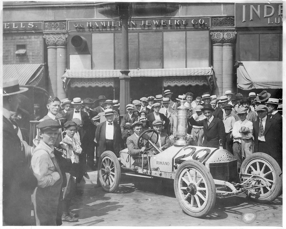 Rea Lentz at the Wheel of his Romano and the Penrose Trophy - Pikes Peak America's Mountain Facebook Page