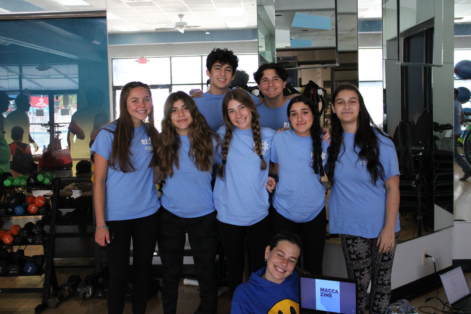 A group of several madrichim working on our annual Maccazine!