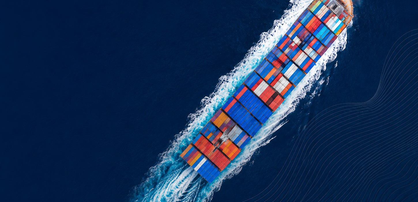 Aerial view of a cargo ship carrying colorful containers.