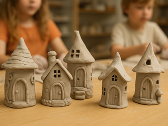 Children engage in creative play, crafting whimsical clay houses with intricate designs.