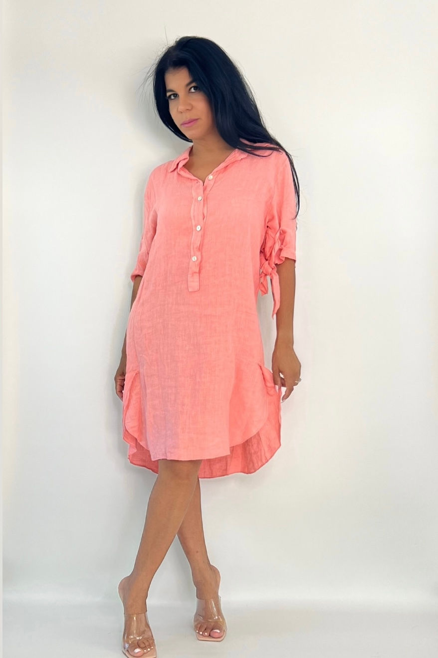 Thumbnail: Woman in coral button-front short dress