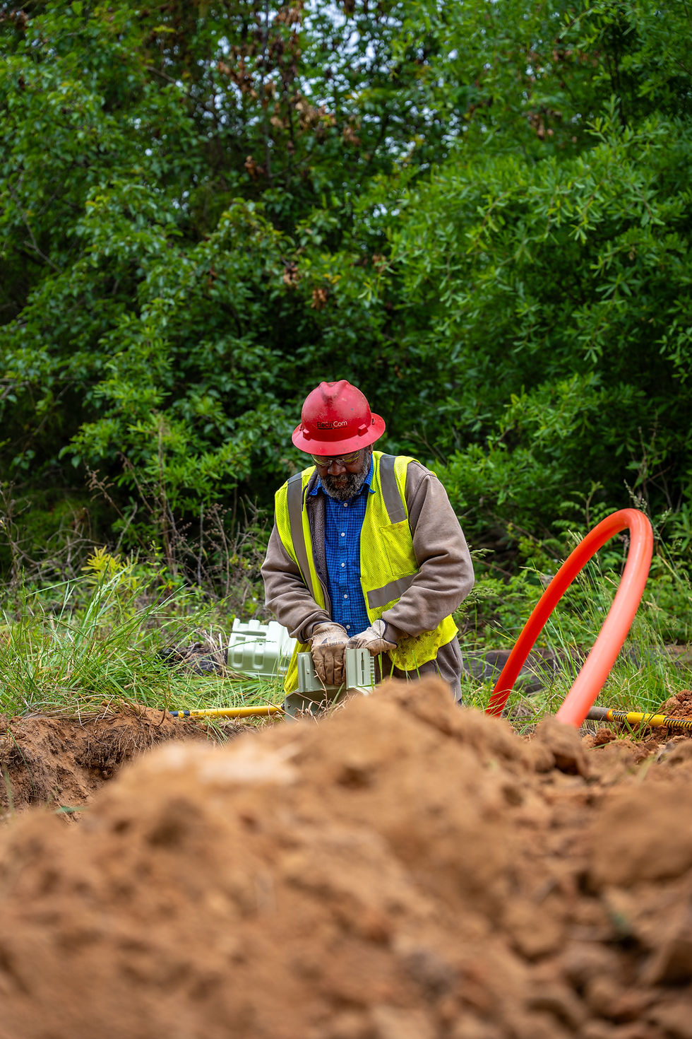 Worker on a utility power and fiber construction case study.